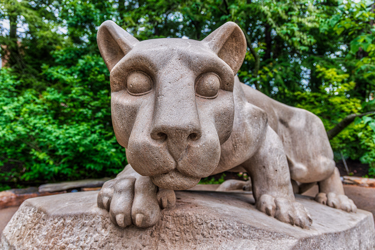 Close-up face-to-face view of the Nittany Lion Shrine at Penn State University Park
