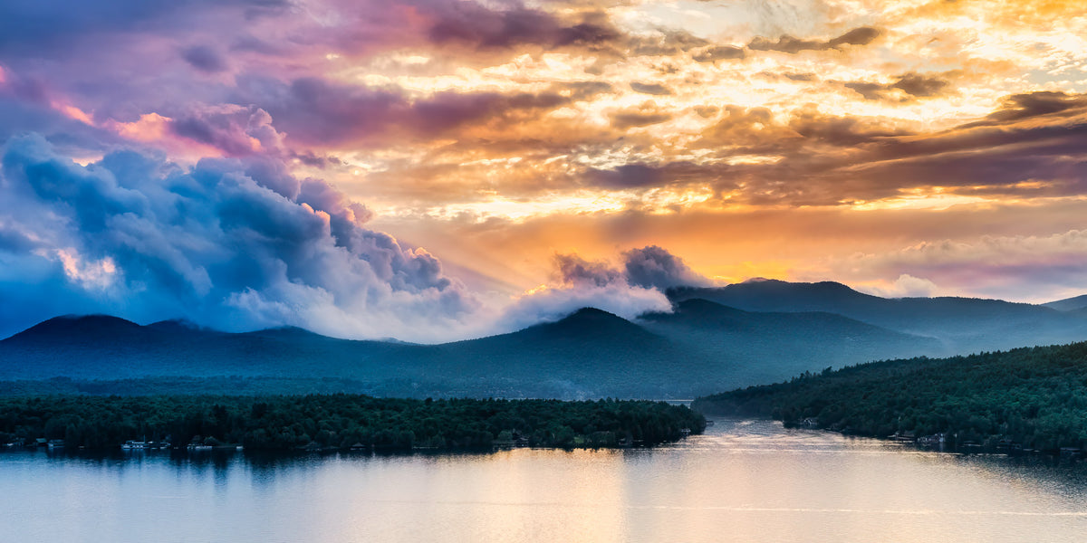Panoramic view of storm clouds over the Adirondack Mountains and Lake Placid at sunset