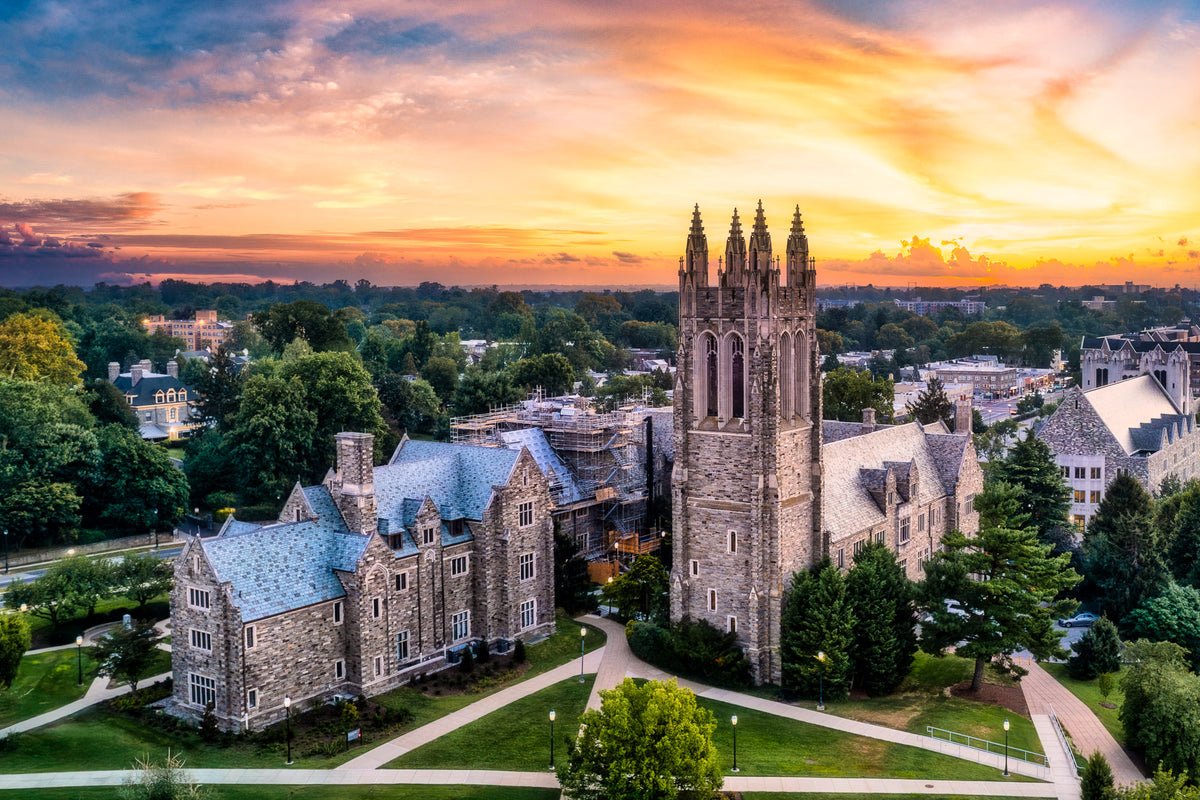 Barbelin Hall at Saint Joseph's University beneath an orange dawn sky